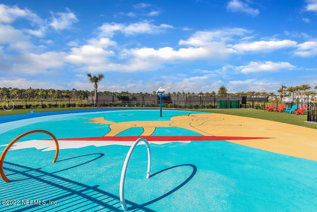 461 Rum Runner Way St. Johns, FL 32259 - Photo 5 of 13 a view of a swimming pool with an outdoor seating yard and mountain view in back