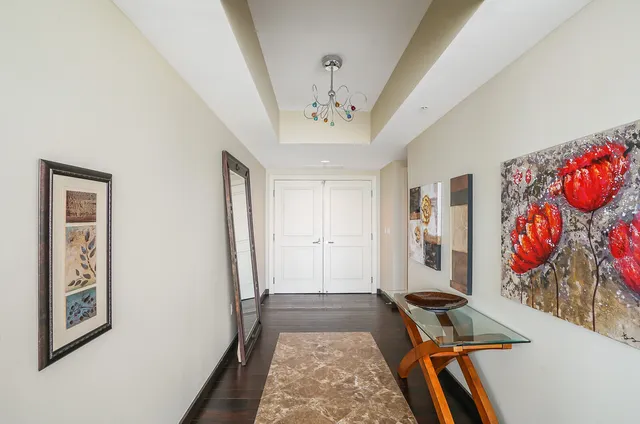 a view of an entryway with wooden floor
