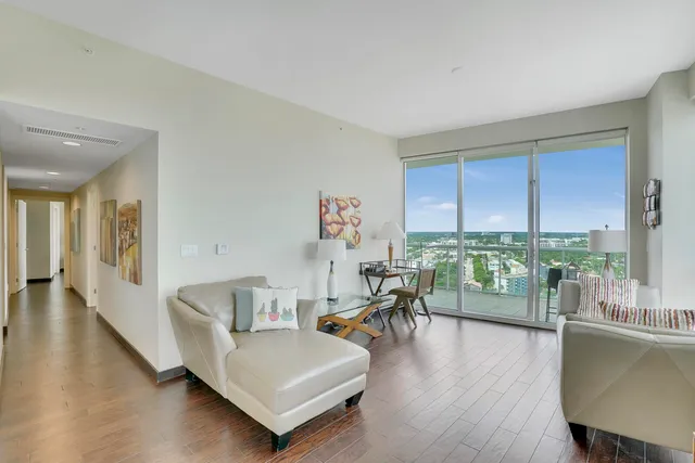 a living room with furniture and a large window
