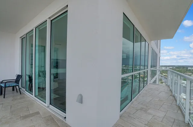 a view of balcony with yard