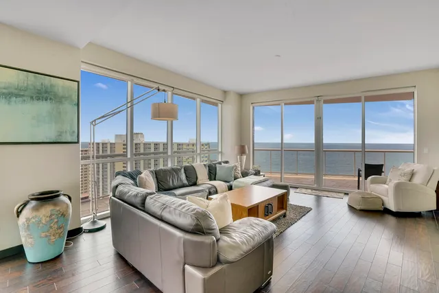a living room with furniture and a large window