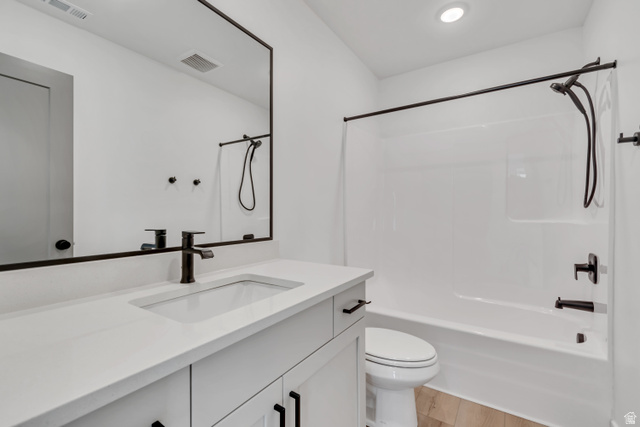 1302 1475 East, Unit 40 Payson, UT 84651 - Photo 26 of 34 Bathroom with vanity, shower / bathtub combination, and light wood-type flooring