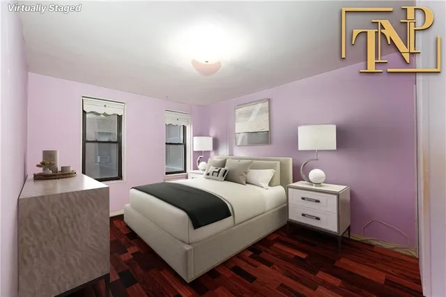 a view of livingroom with painting on the wall and a window