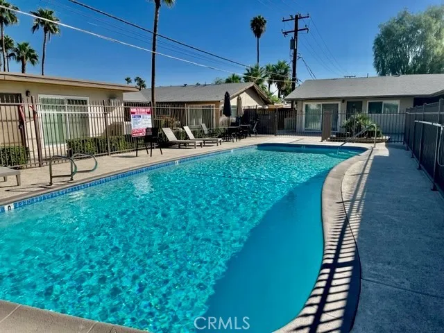 a view of a swimming pool with a deck
