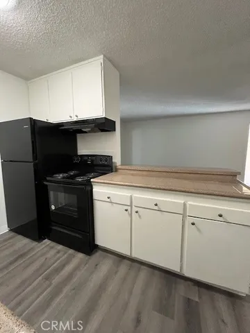 a kitchen with a sink and a stove top oven
