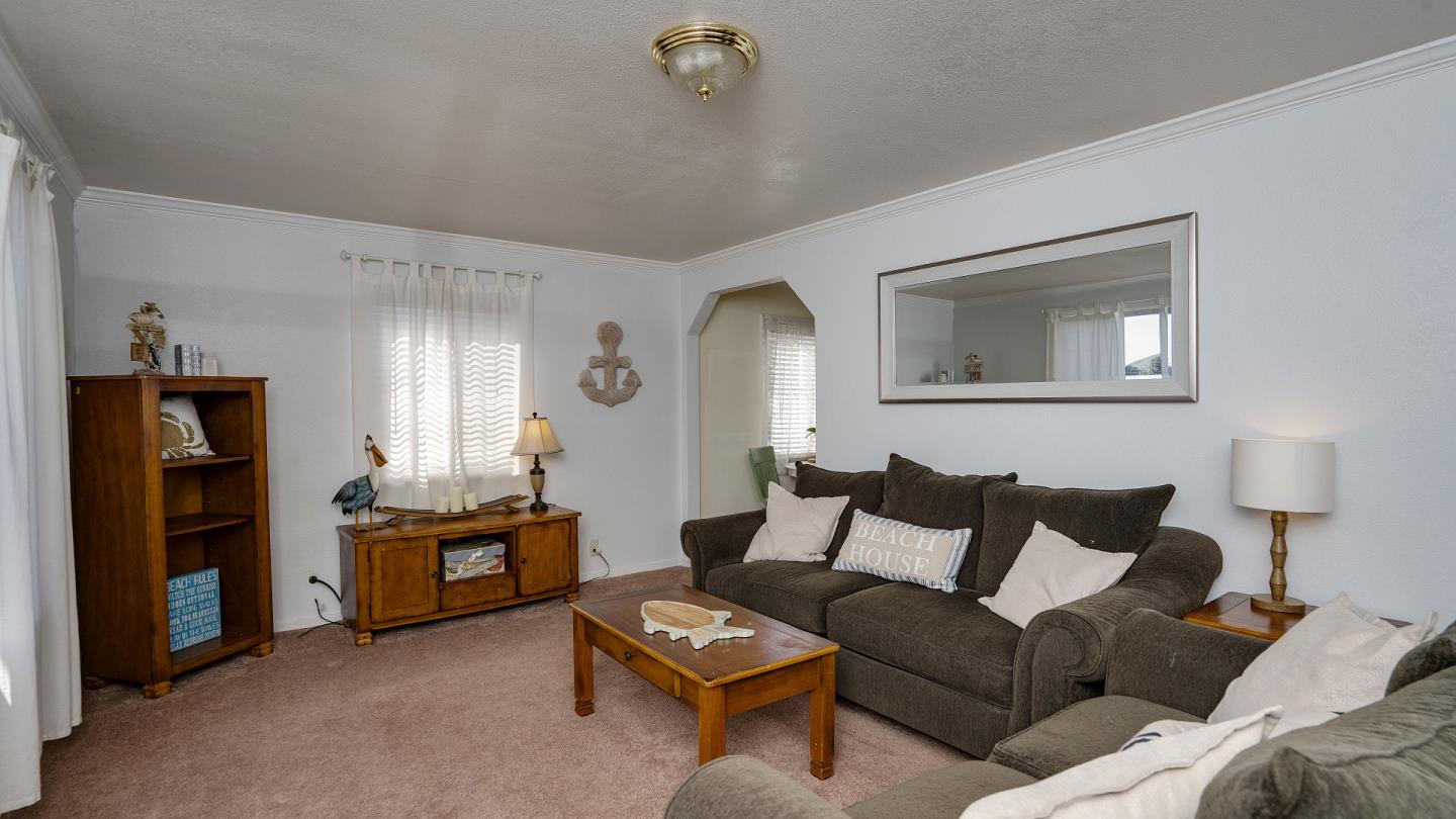 255 Brighton Road Pacifica, CA 94044 - Photo 6 of 29 a living room with furniture and a lamp