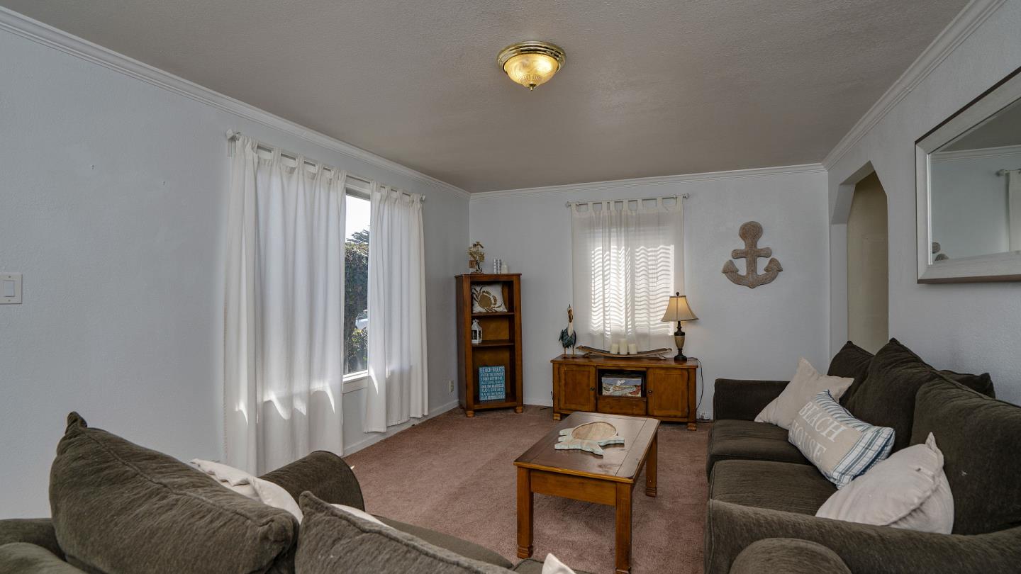 255 Brighton Road Pacifica, CA 94044 - Photo 7 of 29 a living room with furniture and a window