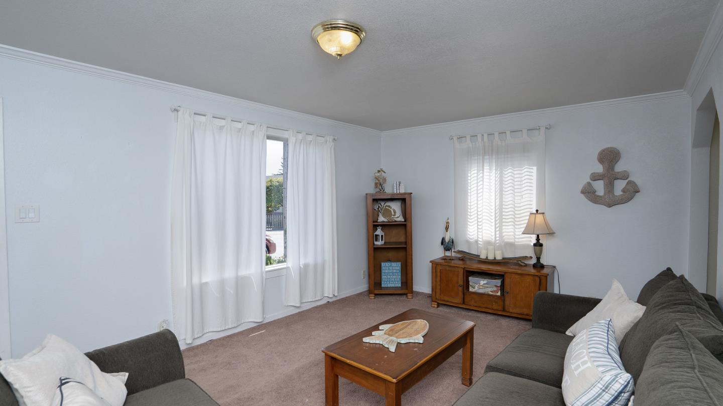 255 Brighton Road Pacifica, CA 94044 - Photo 9 of 29 a living room with furniture and a window