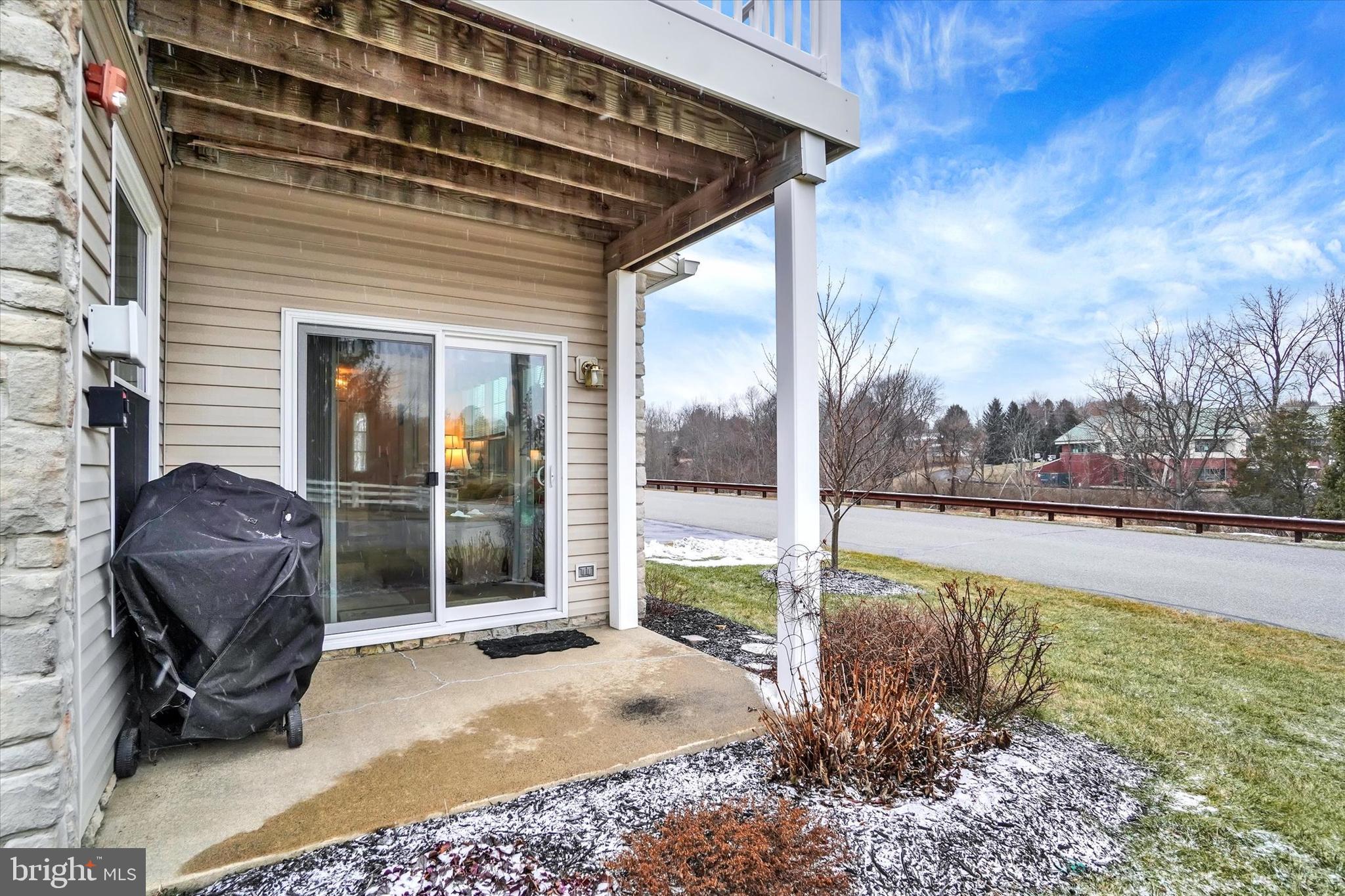 102 Marshview Road, Unit 102 Stewartstown, PA 17363 - Photo 19 of 25 The side porch is the perfect spot for grilling!