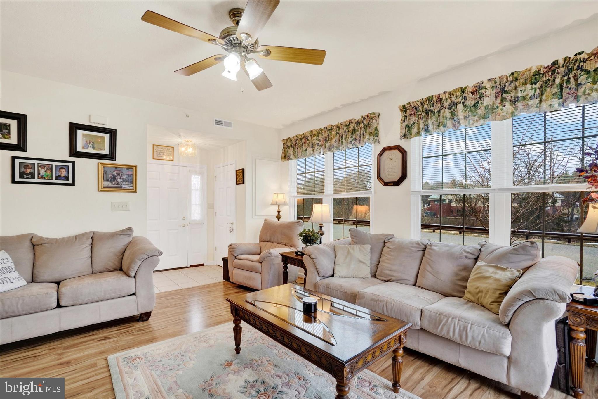 102 Marshview Road, Unit 102 Stewartstown, PA 17363 - Photo 3 of 25 The sun-drenched living room...