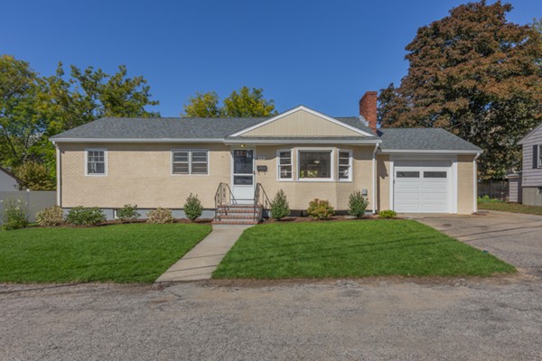 10 Janet Road Arlington, MA 02474 - Photo 1 of 26 a front view of a house with a garden