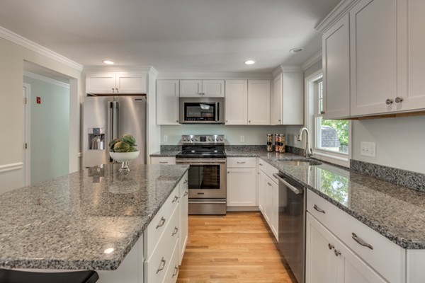 10 Janet Road Arlington, MA 02474 - Photo 13 of 26 a large kitchen with granite countertop a large counter top stainless steel appliances and cabinets