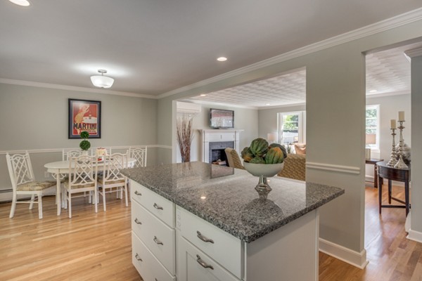 10 Janet Road Arlington, MA 02474 - Photo 16 of 26 a kitchen with stainless steel appliances granite countertop a kitchen island a stove a table and chairs