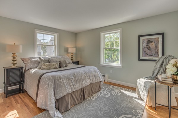 10 Janet Road Arlington, MA 02474 - Photo 17 of 26 a bed room with a bed and two windows
