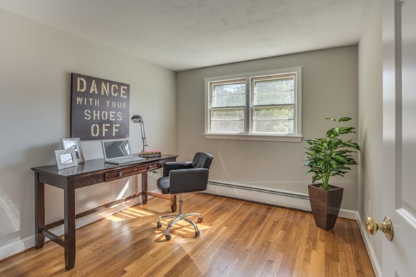 10 Janet Road Arlington, MA 02474 - Photo 20 of 26 a view of a workspace with furniture and a potted plant