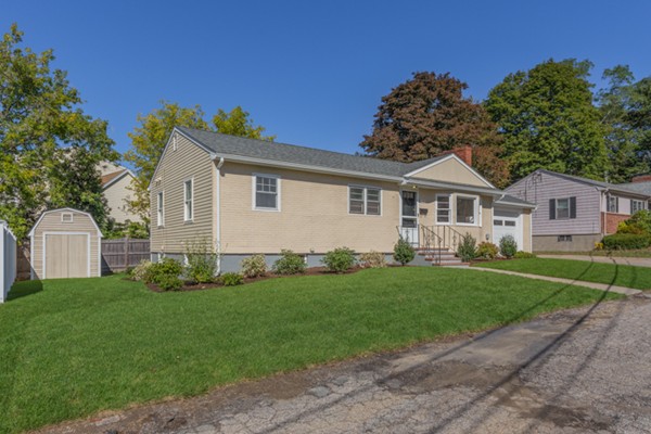 10 Janet Road Arlington, MA 02474 - Photo 2 of 26 a front view of a house with a garden