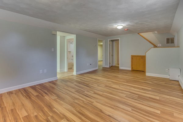 10 Janet Road Arlington, MA 02474 - Photo 21 of 26 a view of an empty room with wooden floor
