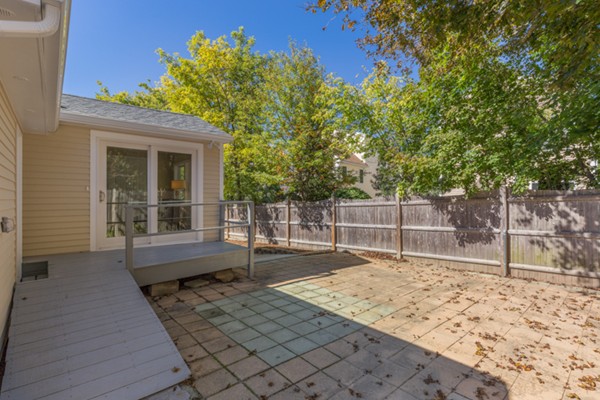 10 Janet Road Arlington, MA 02474 - Photo 24 of 26 a backyard of a house with table and chairs