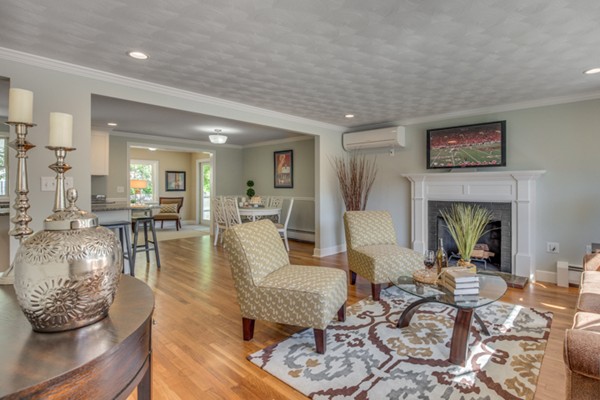 10 Janet Road Arlington, MA 02474 - Photo 5 of 26 a living room with furniture and a fireplace
