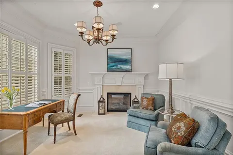 a spacious bathroom with a double vanity sink a mirror a bathtub and shower