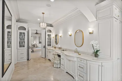 a bathroom with a granite countertop sink and a bathtub