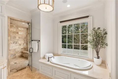 a bathroom with a bathtub and shower