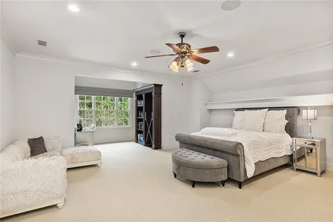 a media room with furniture a projector and a projector screen