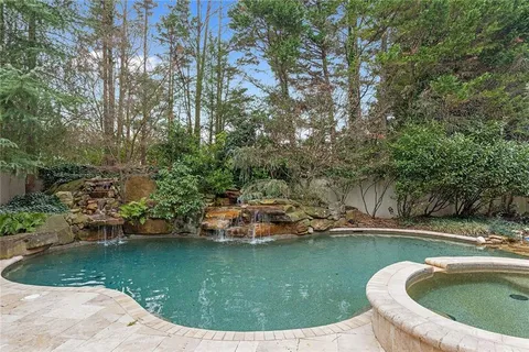 a view of swimming pool with a yard