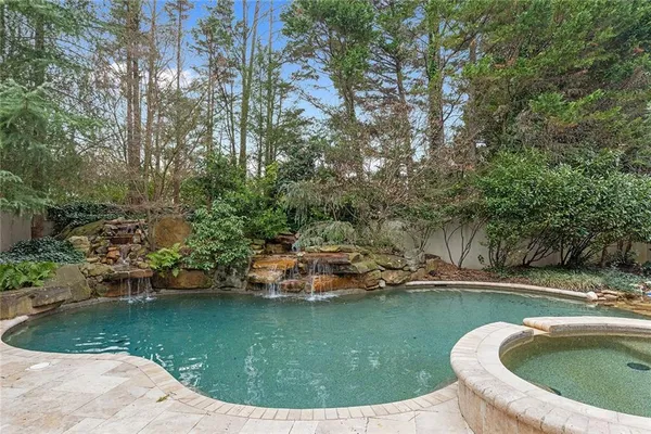a view of swimming pool with a yard