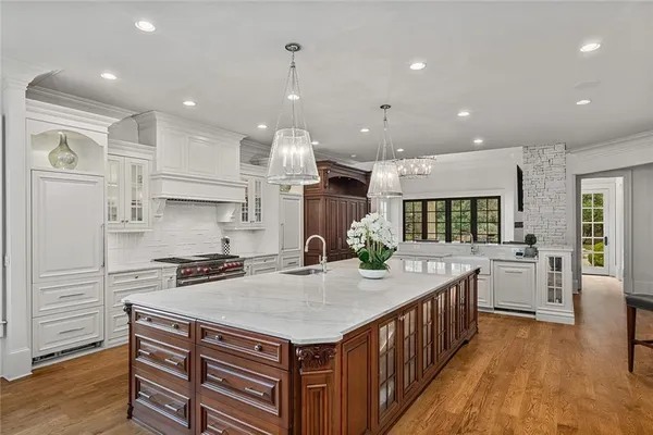 a kitchen with a sink and cabinets