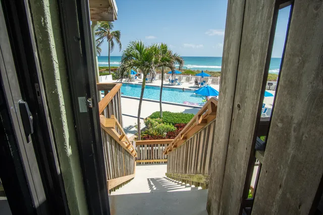 a view of swimming pool from a balcony