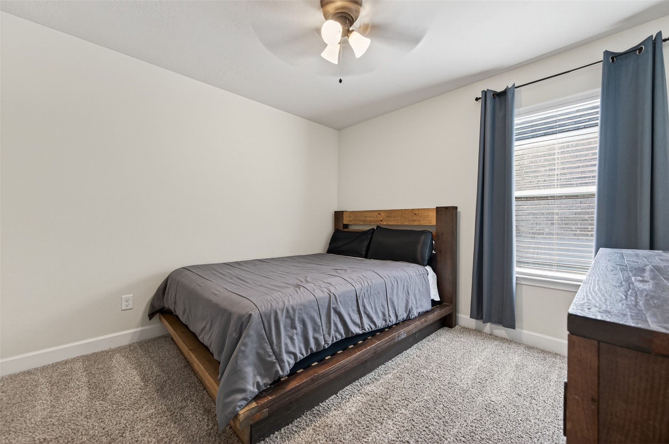 917 Farm Path Brenham, TX 77833 - Photo 31 of 43 a bedroom with a bed and window