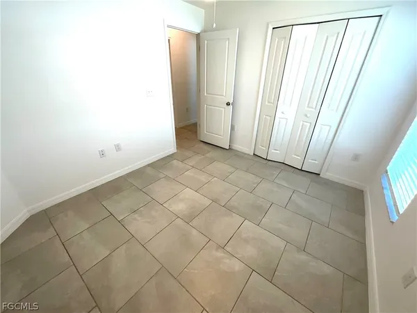 a bathroom with a sink a toilet a mirror and shower