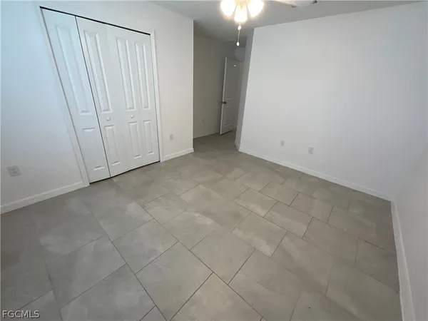 a bathroom with a glass door shower and a sink