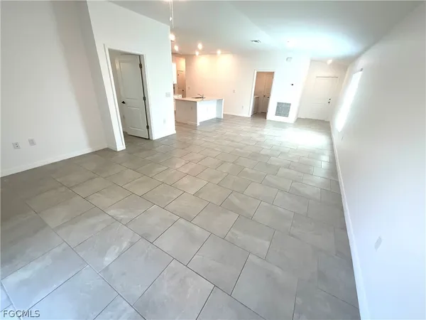 a view of a big room with closet and a large window