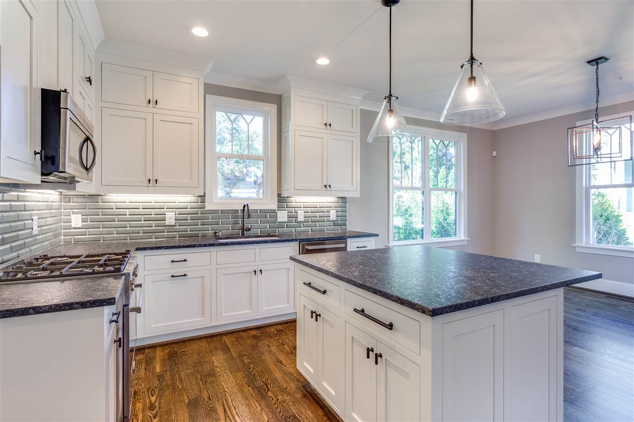 1307 Filmore Street Raleigh, NC 27605 - Photo 5 of 24 Bertazzoni Appliances, custom double-stacked cabinets, island, leathered countertops, tile backsplash with under-cab lights & large pantry. Kitchen