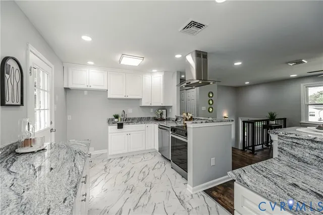 a kitchen with a sink stove and refrigerator