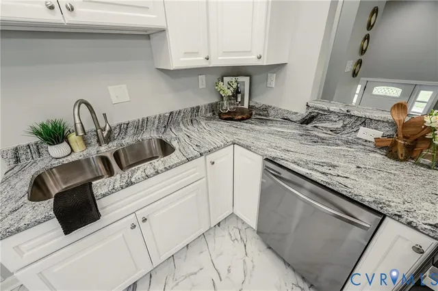 a kitchen with a sink and cabinets