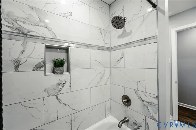 a bathroom with a sink a toilet a mirror and a window