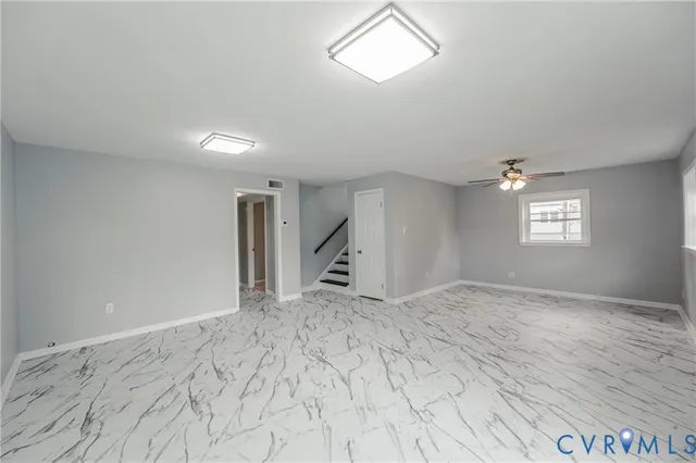 a view of empty room with windows