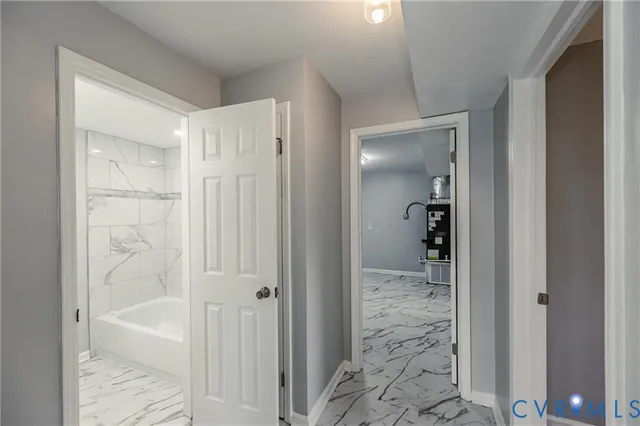 a bathroom with a glass shower door