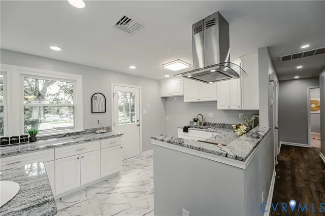 a kitchen with a sink stove and cabinets