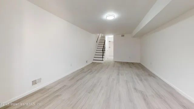 a view of room with stairs and a window