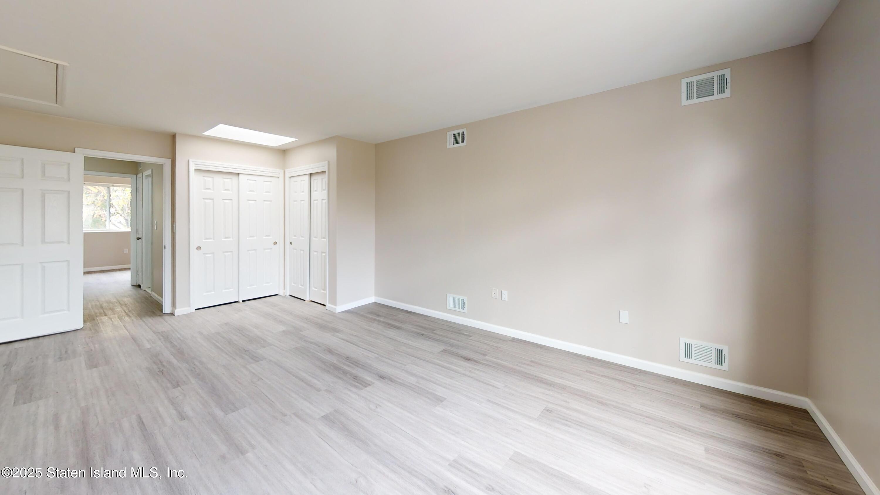 109 Lyceum Court Staten Island, NY 10310 - Photo 21 of 32 a view of an empty room and wooden floor