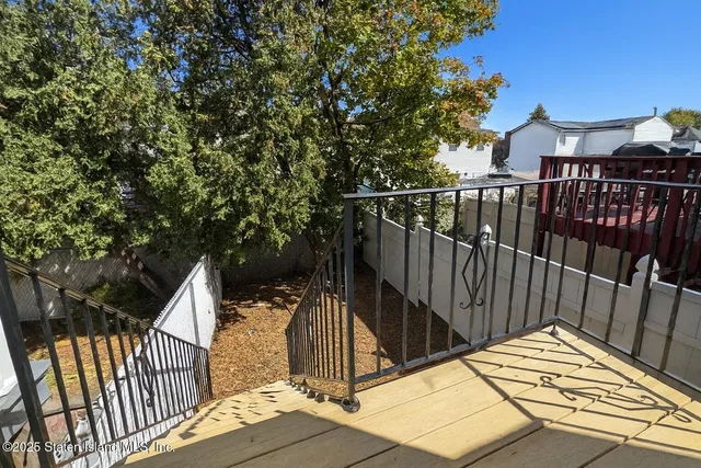 a view of balcony and wooden floor