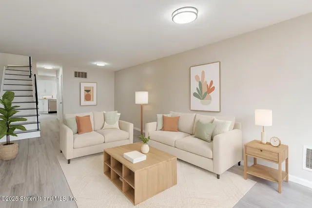 a living room with furniture and a couch