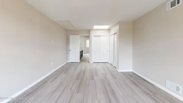 a view of wooden floor and brick walls