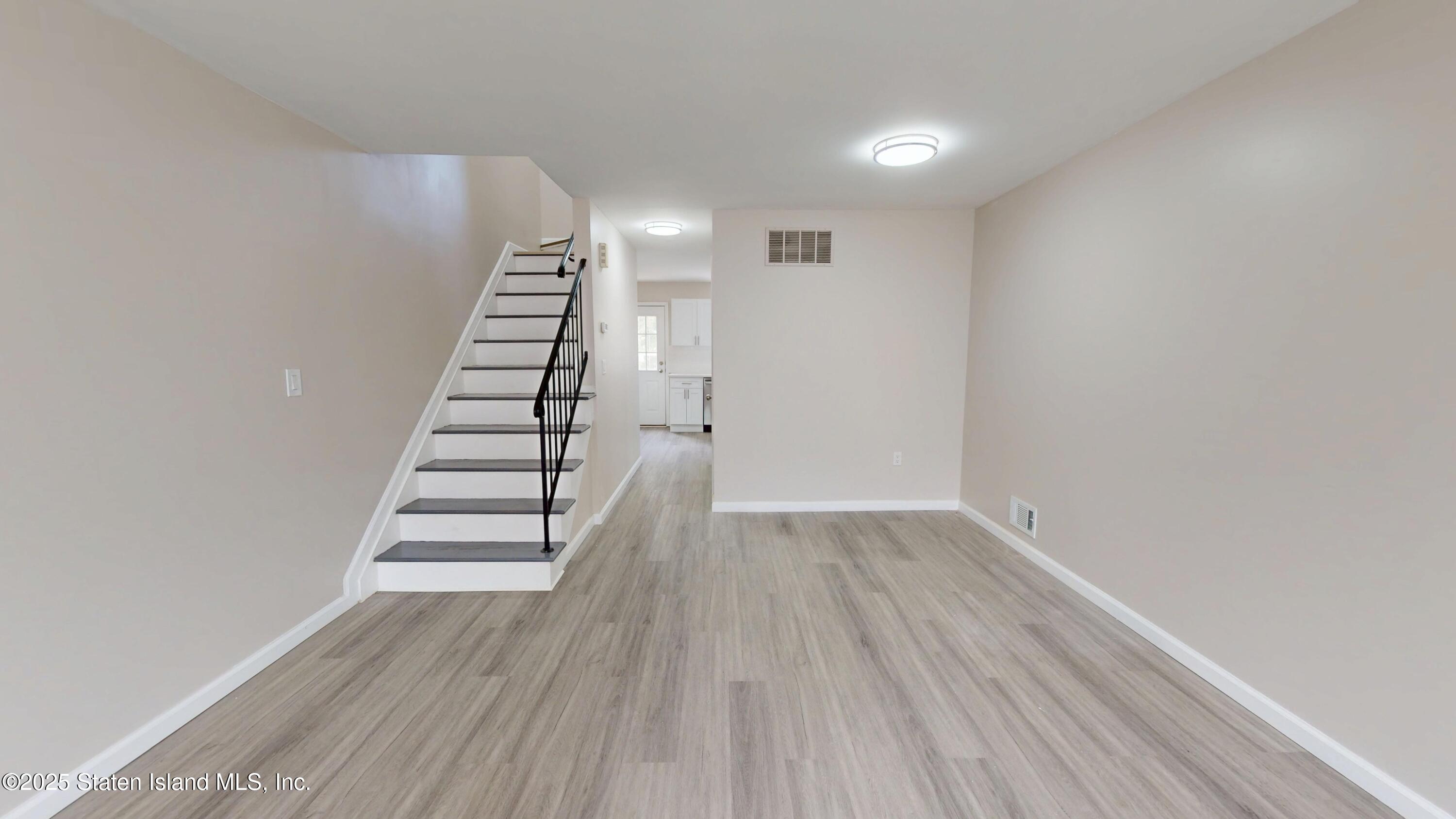109 Lyceum Court Staten Island, NY 10310 - Photo 10 of 32 a view of wooden floor and windows in a room