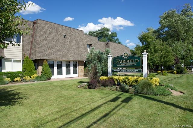 475 Little E Neck Road, Unit L467 West Babylon, NY 11704 - Photo 2 of 6 a front view of a house with garden