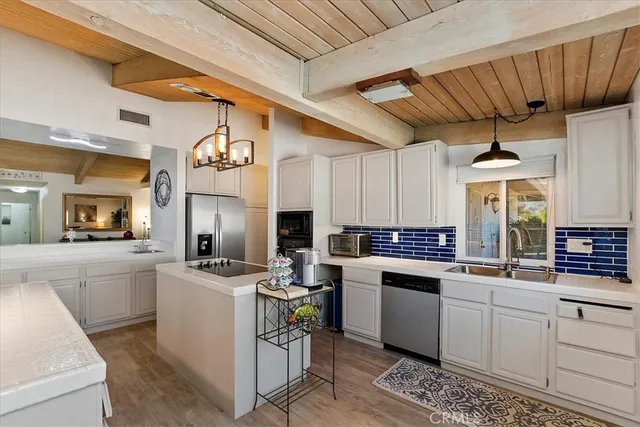 a kitchen with a sink and cabinets
